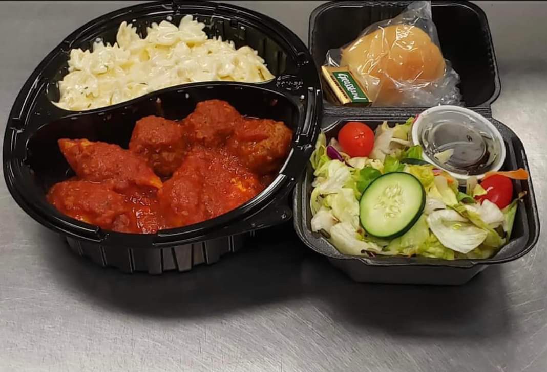 Takeout meatballs with pasta, salad, and roll